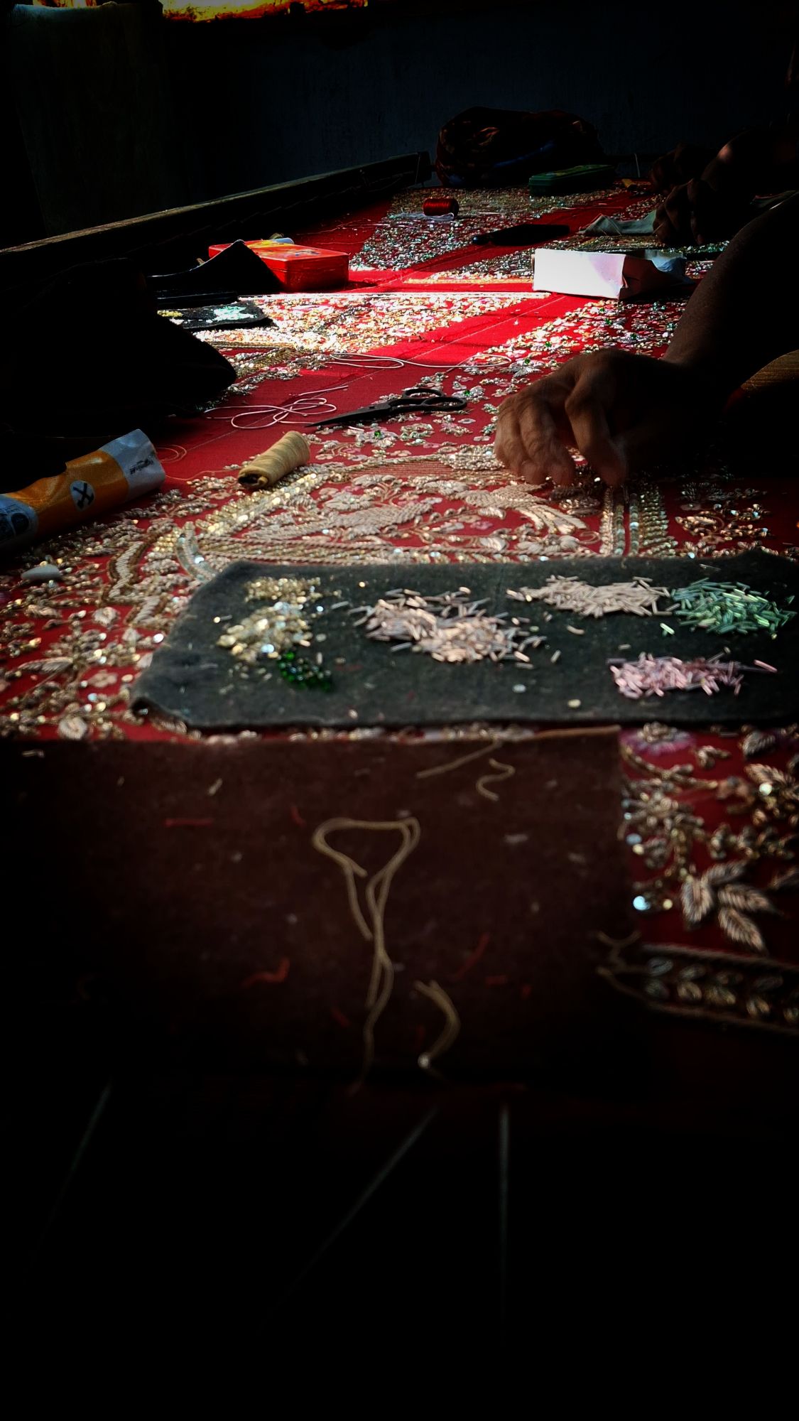 Karigar working on bridal lookbook piece